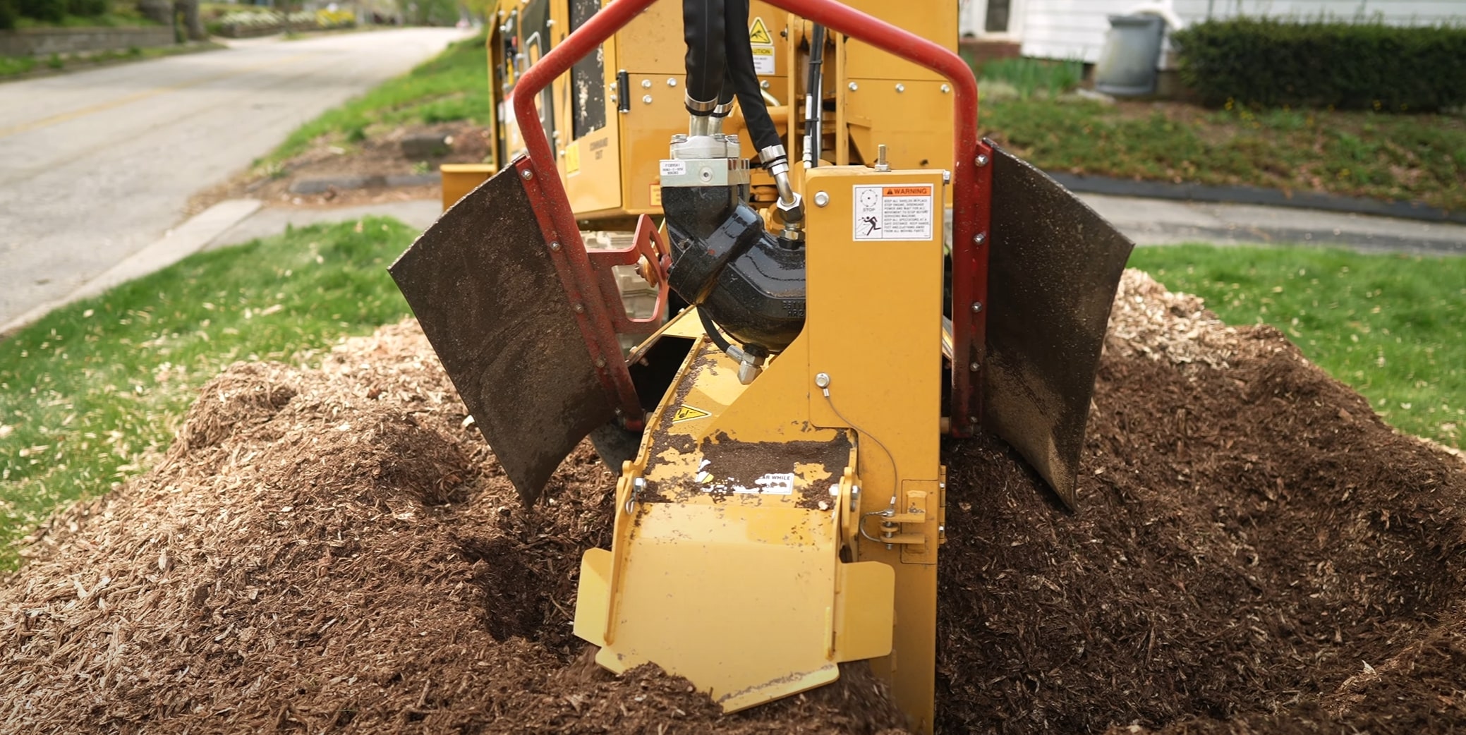 Professional stump grinding equipment removing tree stump in Poway, CA